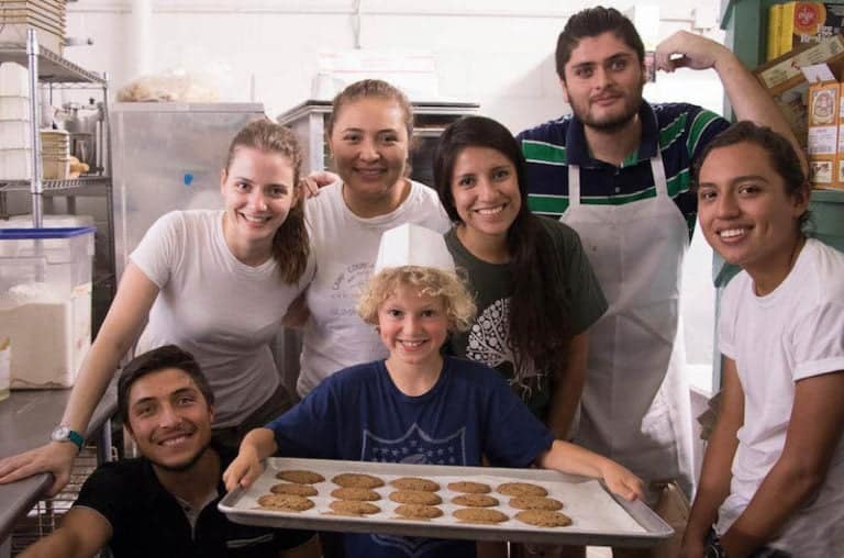 Cookies-making-activity-at-eden-village-camp-children-involving-in-cooking-class-in-kitchen-educational-summer-camp.