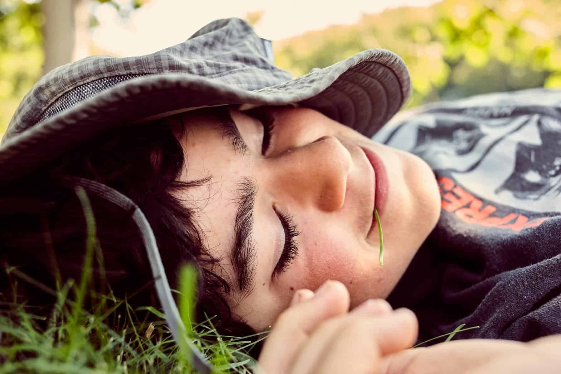 kid resting in the grass